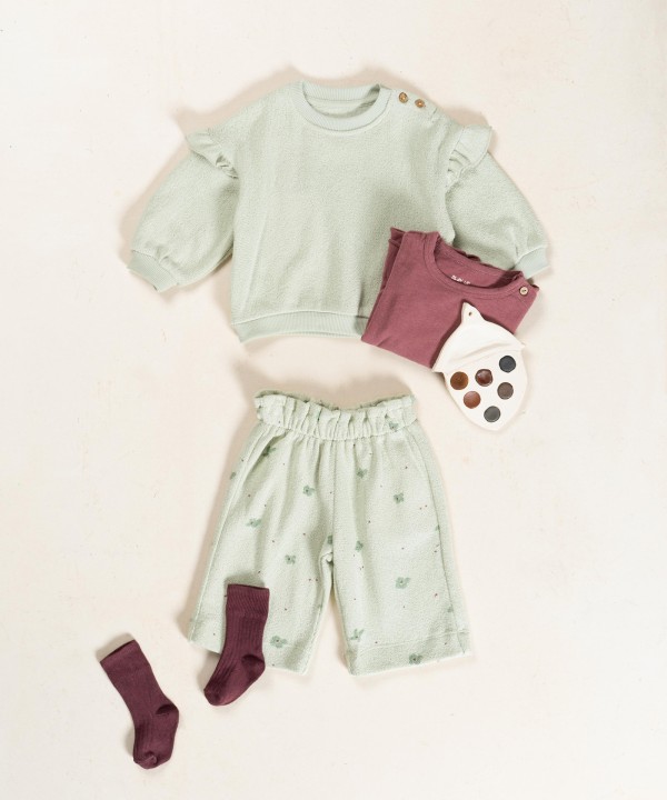 Pantaloni in maglina con stampa floreale