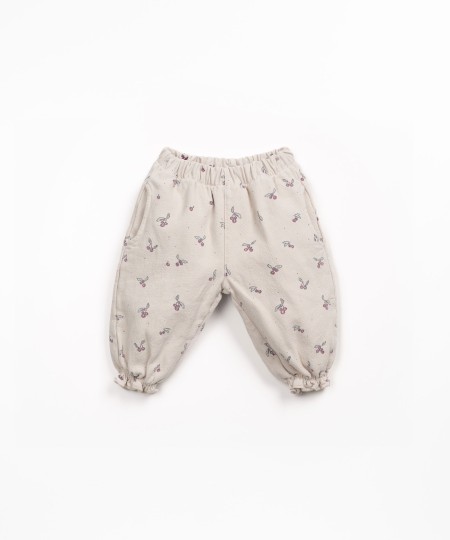 Printed cotton twill trousers with strawberry tree pattern