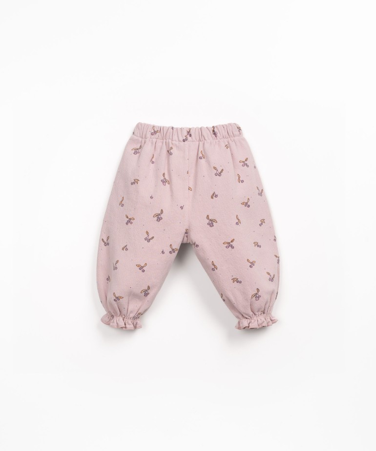 Cala de sarja com estampado de medronhos