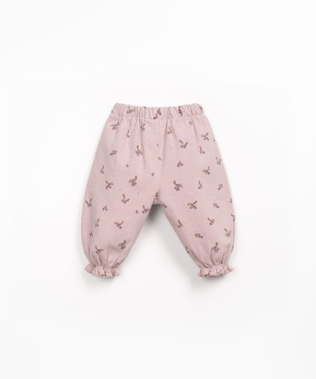 Printed cotton twill trousers with strawberry tree pattern