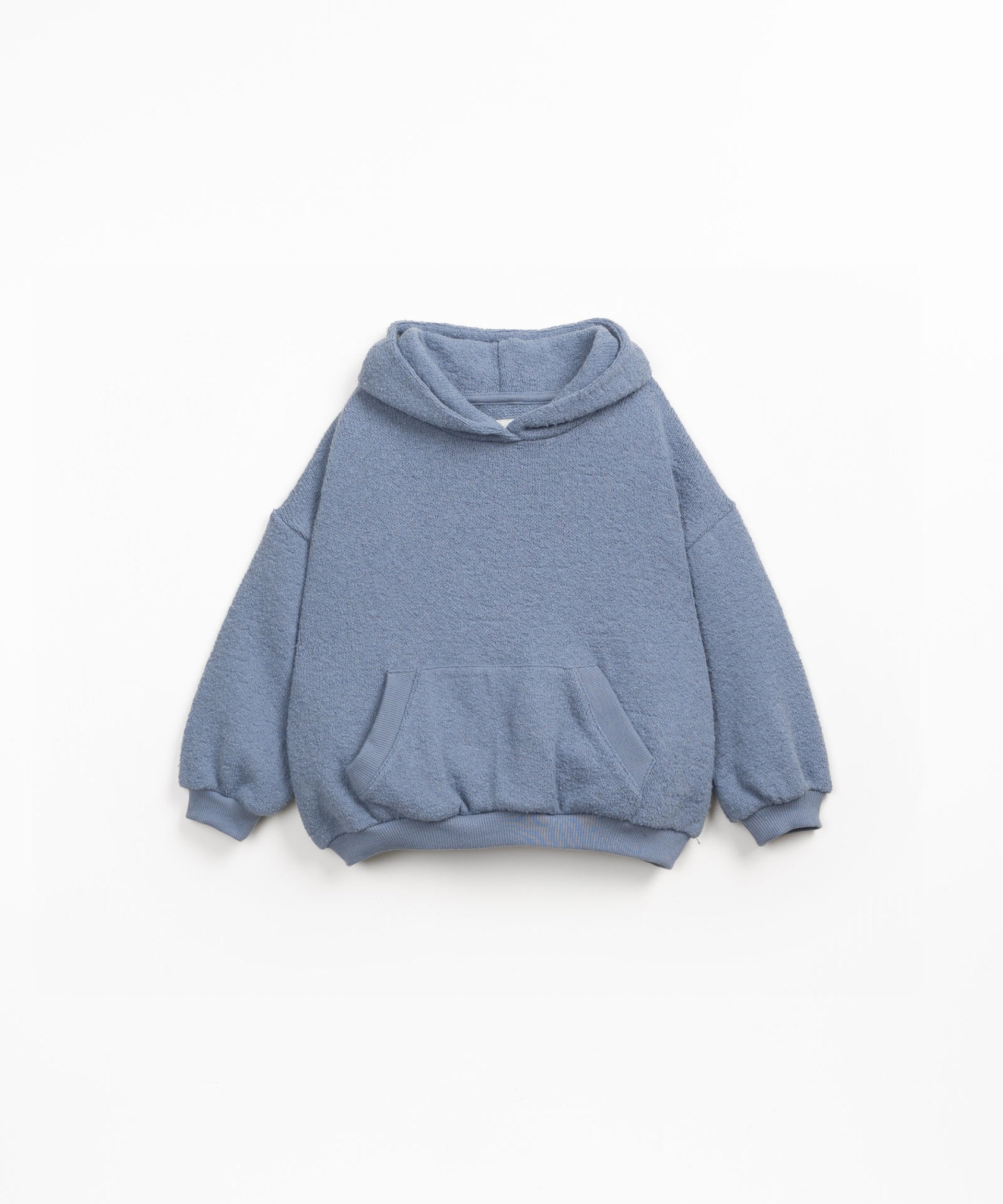Sweater made with a blend of natural fibers and recycled fibers