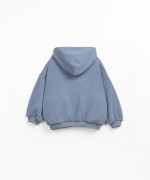 Sweater made with a blend of natural fibers and recycled fibers