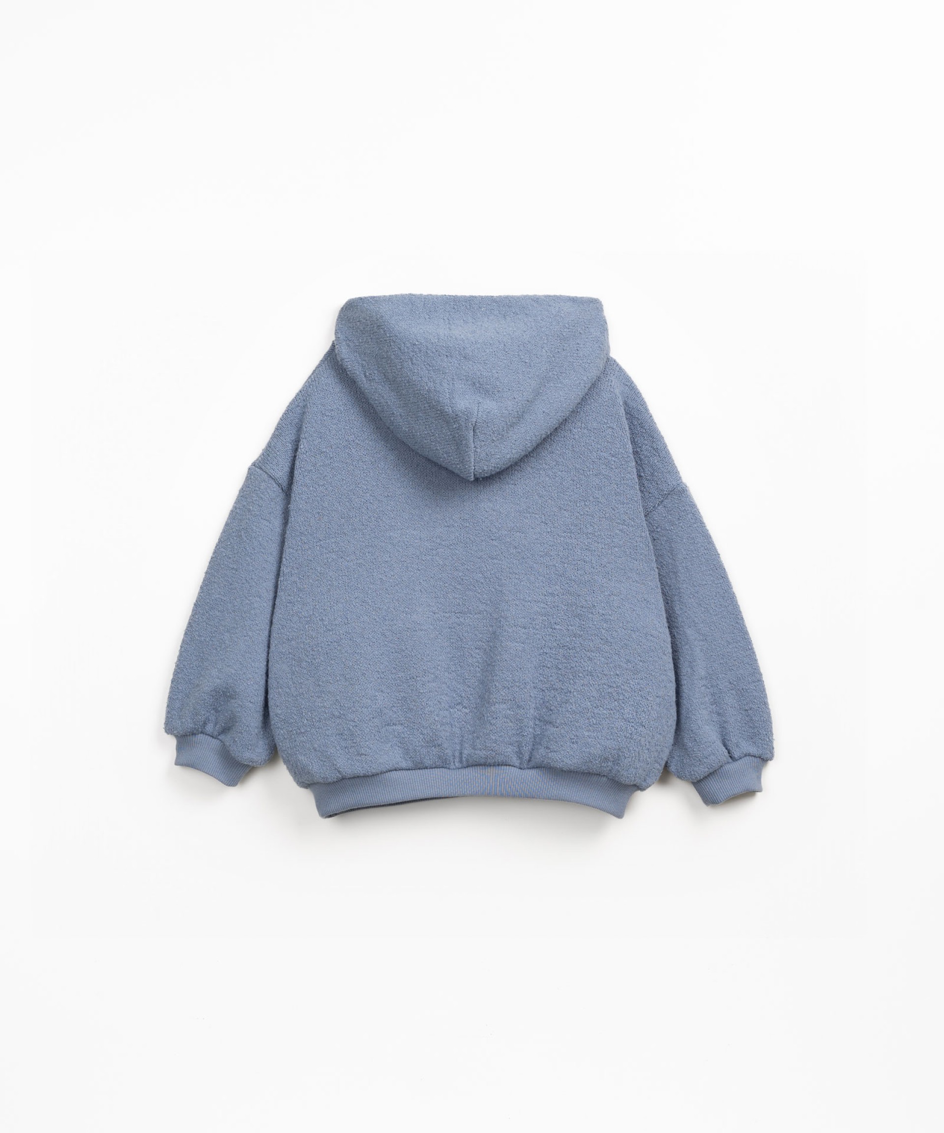 Sweater made with a blend of natural fibers and recycled fibers