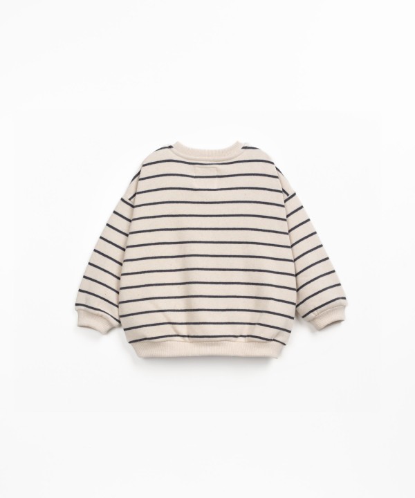 Maglione a righe con polsini