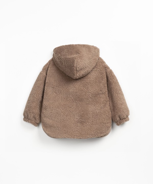 Coat with jersey lining in mixture of organic cotton and recycled cotton