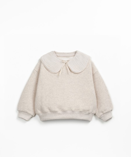 Sweater with a mix of natural and recycled fibers