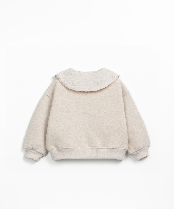 Sweater with a mix of natural and recycled fibers