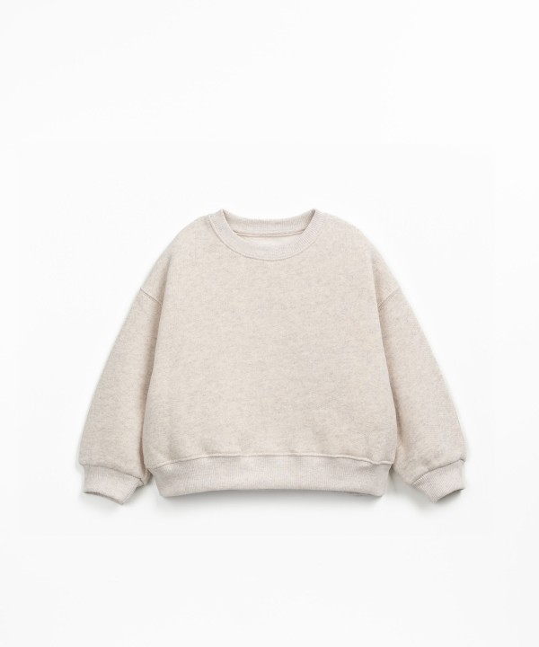 Sweater with a mix of natural and recycled fibers