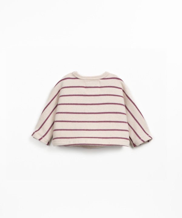 Knit sweater with a blend of natural fibers and recycled cotton