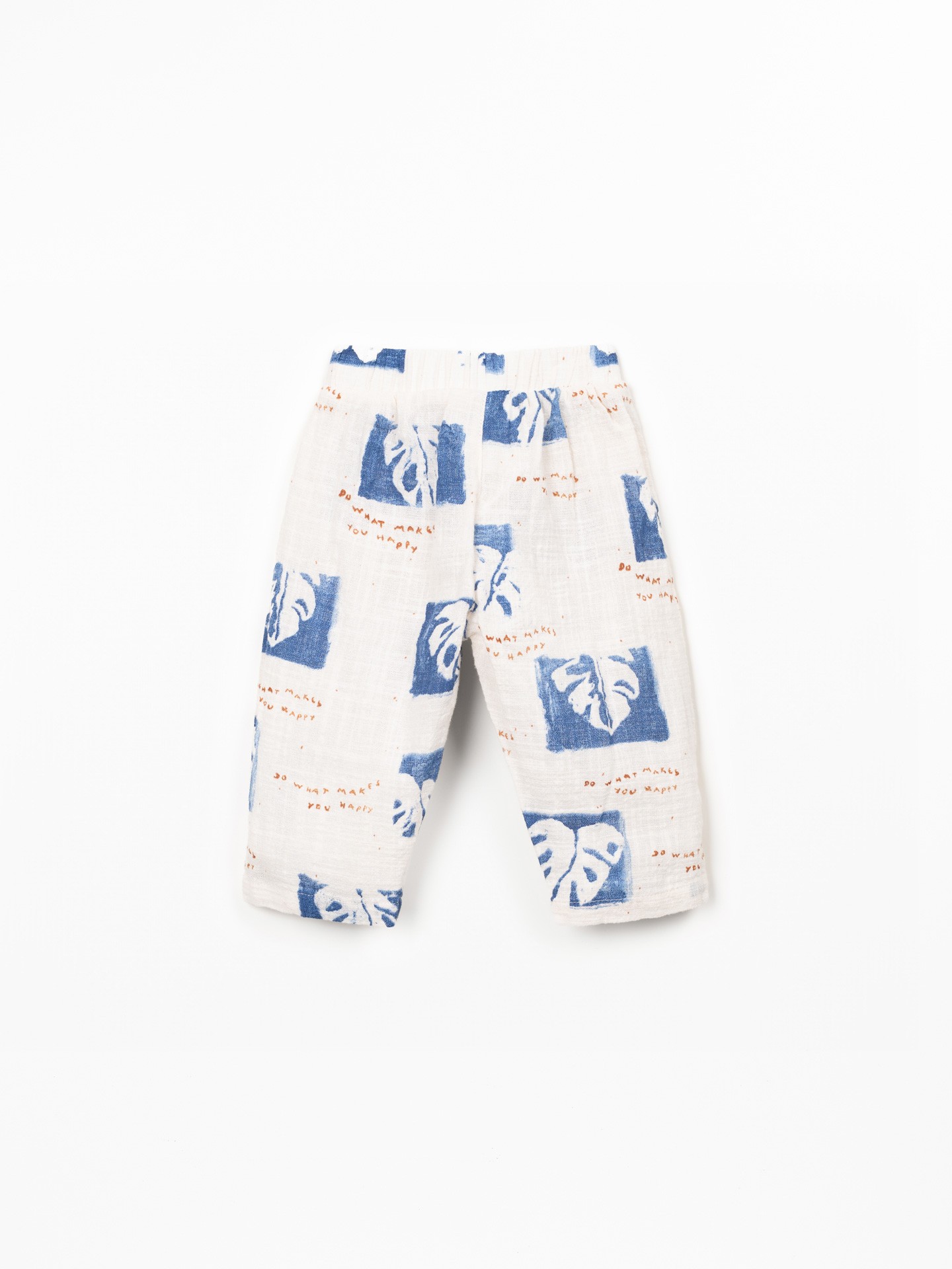 Pantaloni in tessuto con stampa di monsteras