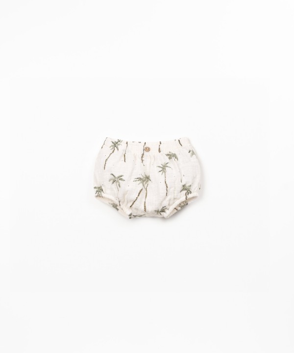 Organic cotton shorts with palm tree print