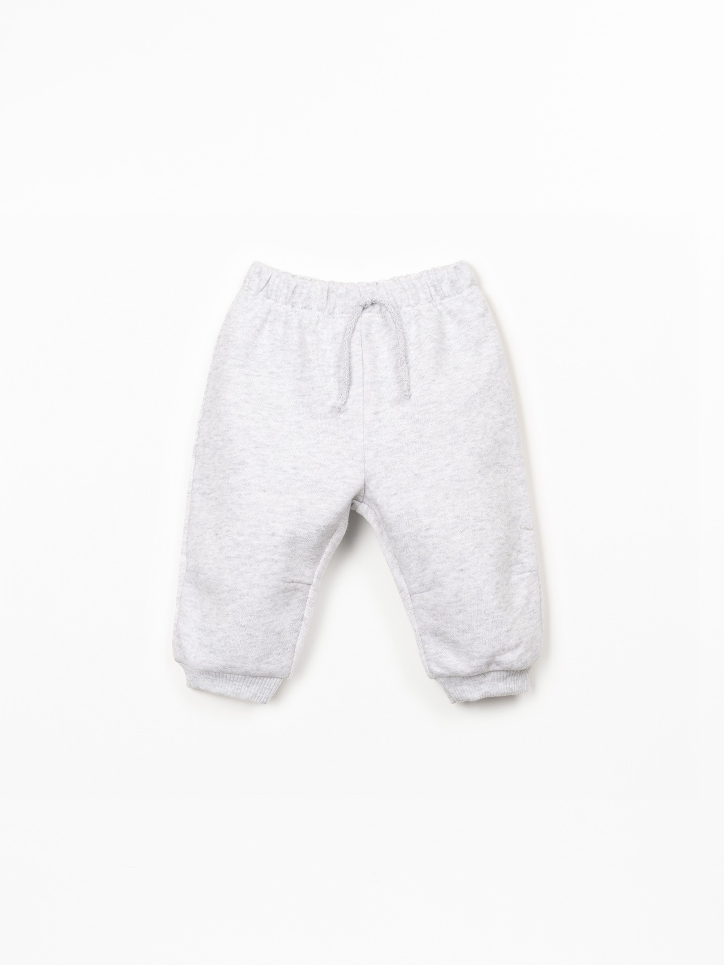 Trousers with decorative drawstring