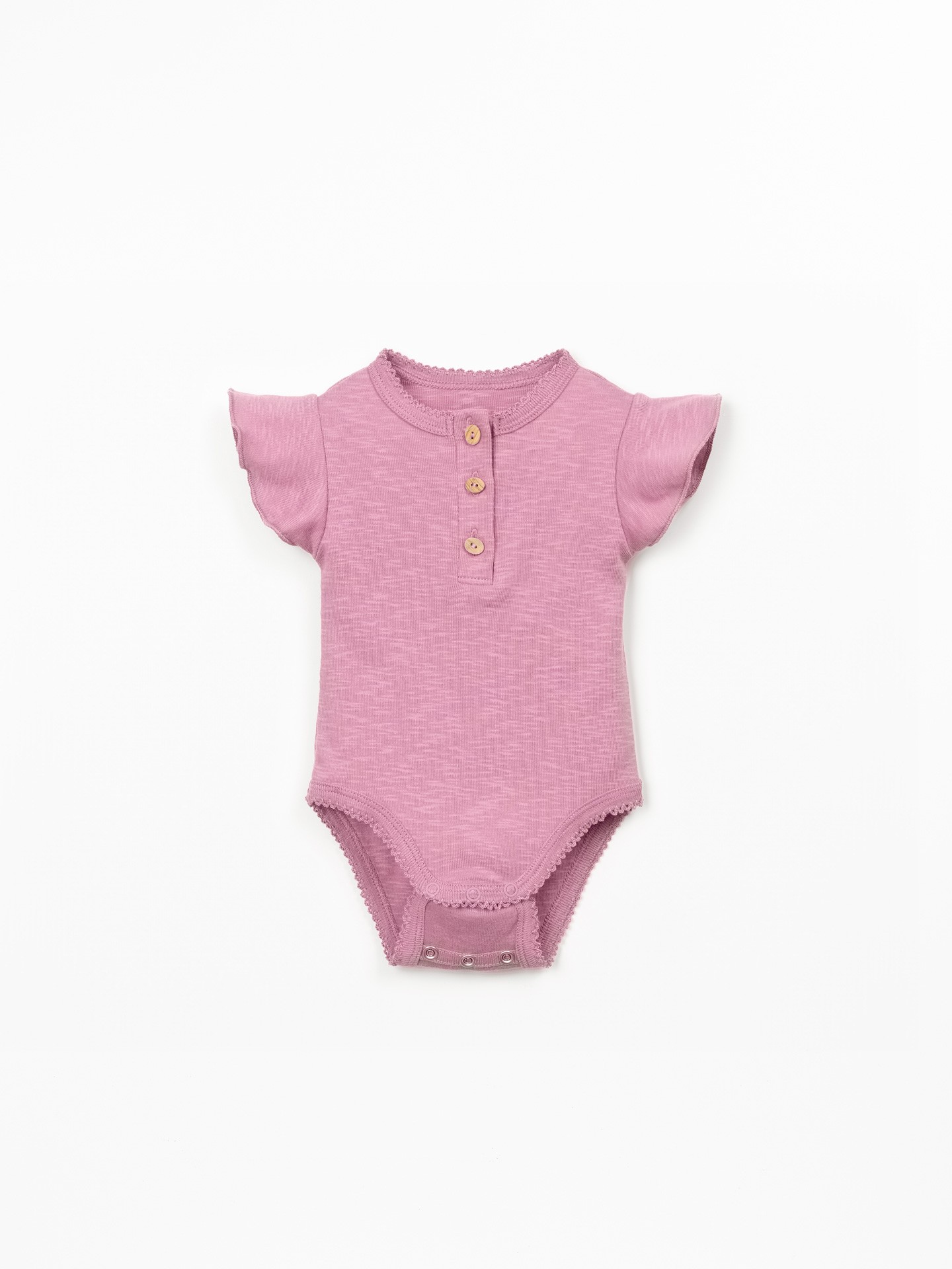Organic cotton bodysuit with ruffle insert on the sleeve