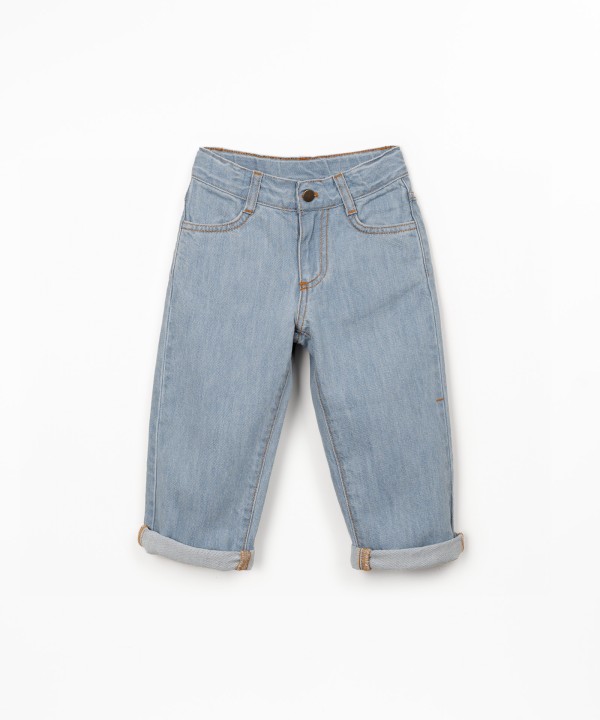 Denim trousers with adjustable belt