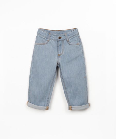 Denim trousers with adjustable belt