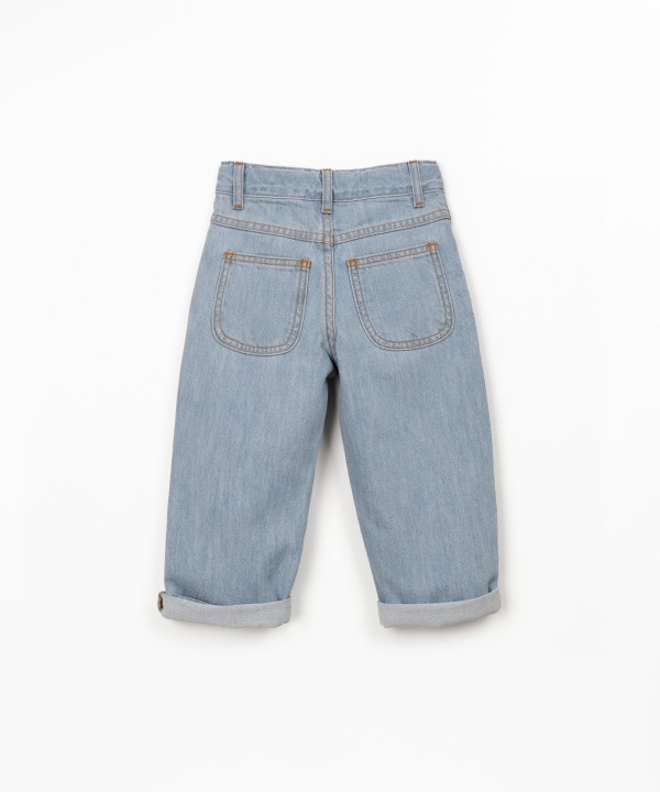 Denim trousers with adjustable belt