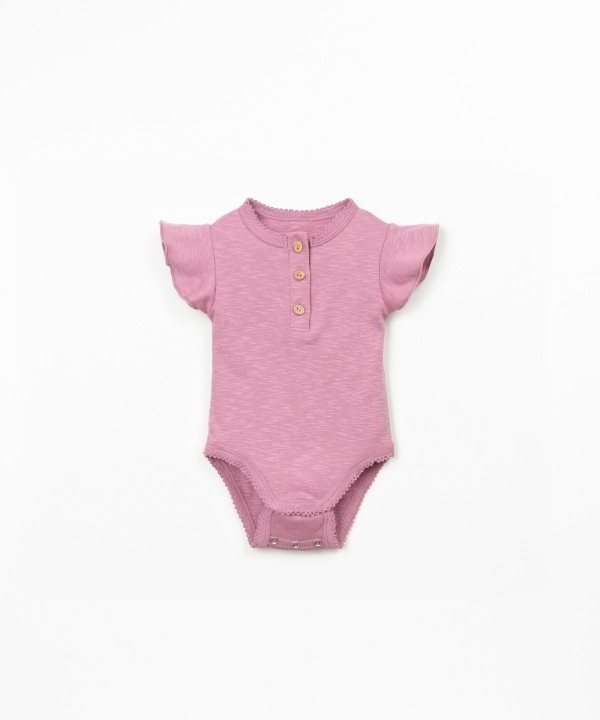 Body in cotone biologico con inserto a volant sulla manica