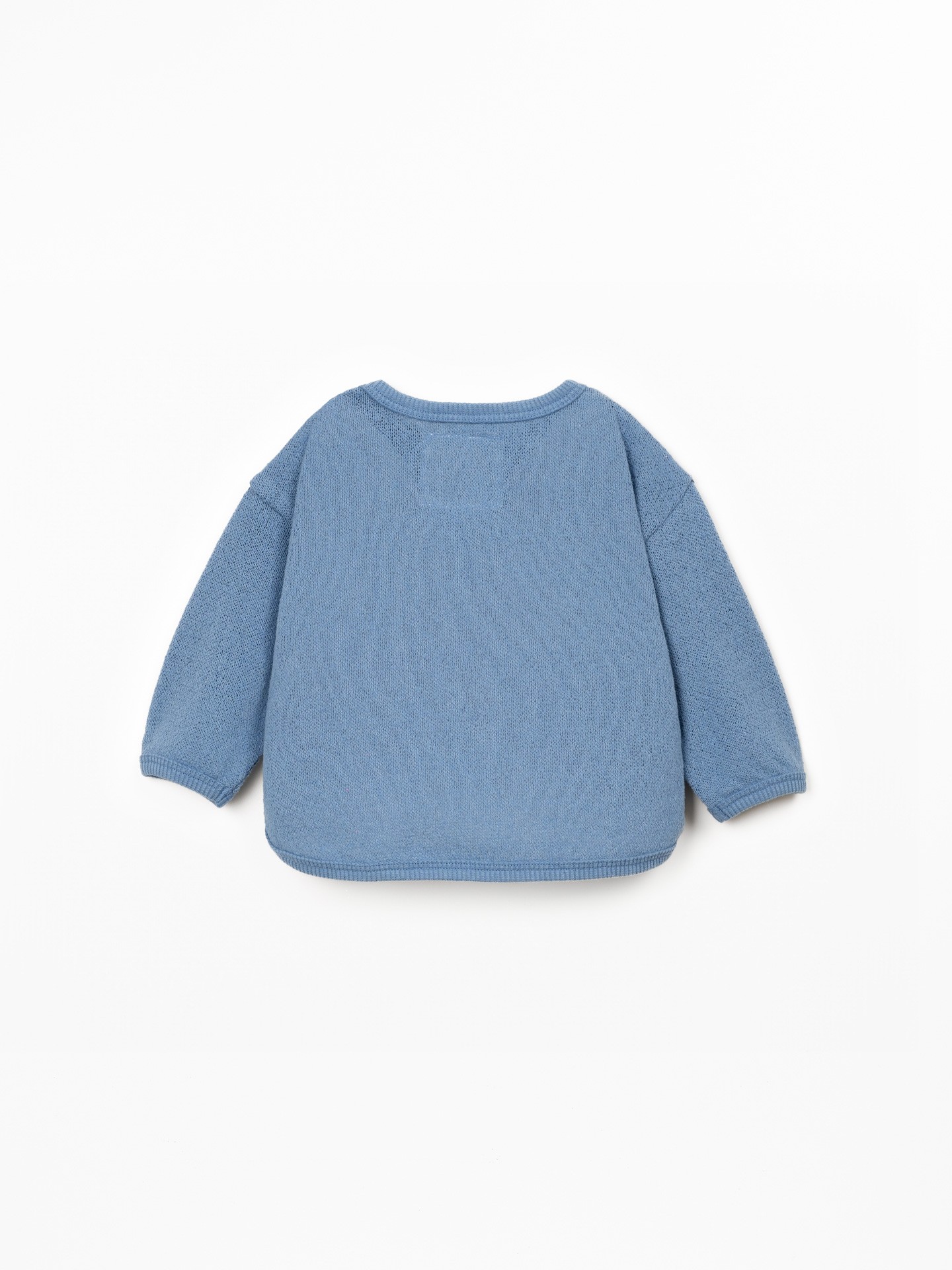 Knit sweater with recycled fibers