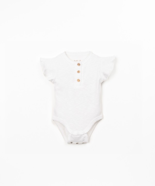 Organic cotton bodysuit with ruffle insert on the sleeve
