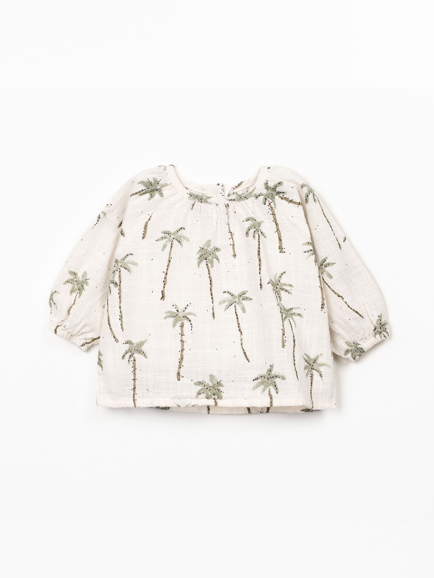 Blusa de tecido com estampado de palmeiras