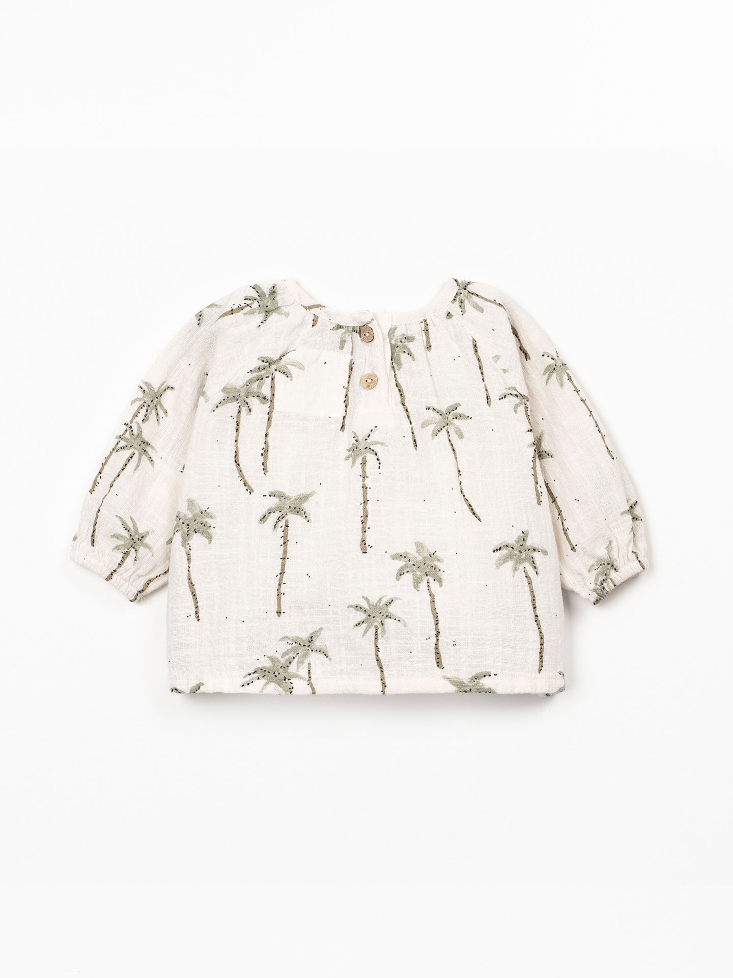 Blusa de tecido com estampado de palmeiras