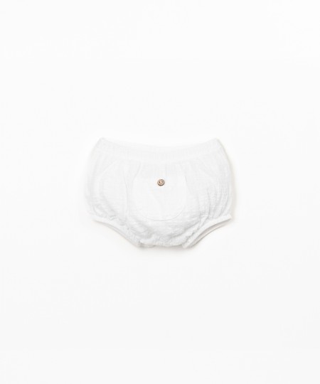 Cal��o de tecido comm bolso 