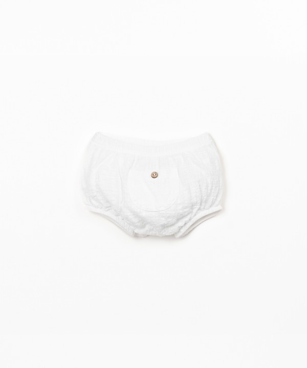 Cal��o de tecido comm bolso 