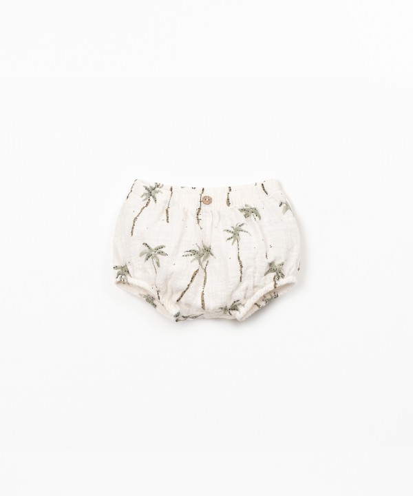 Cal��o de algod�o org�nico com estampado de palmeiras