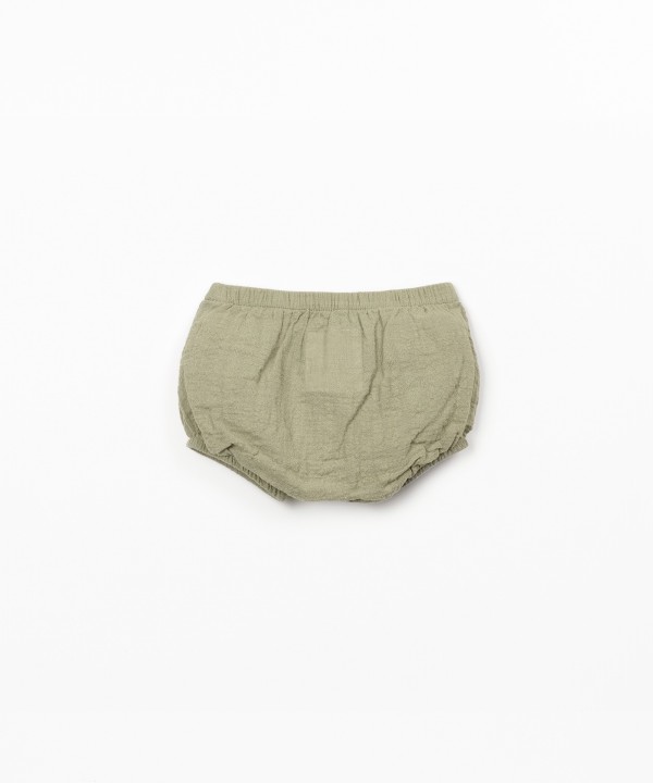 Cal��o de tecido comm bolso 