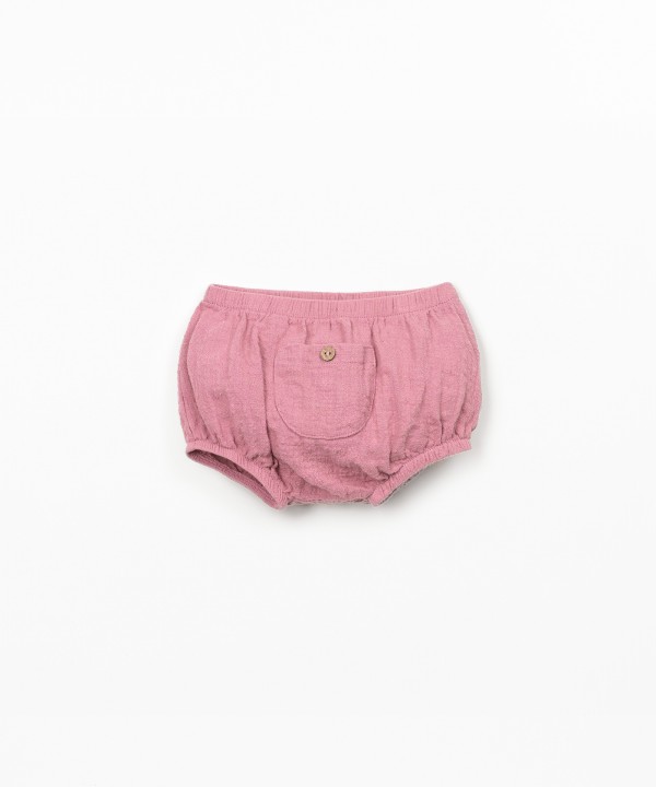 Cal��o de tecido comm bolso 