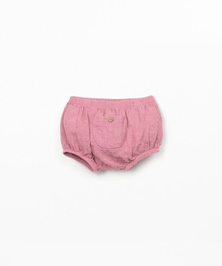 Cal��o de tecido comm bolso 