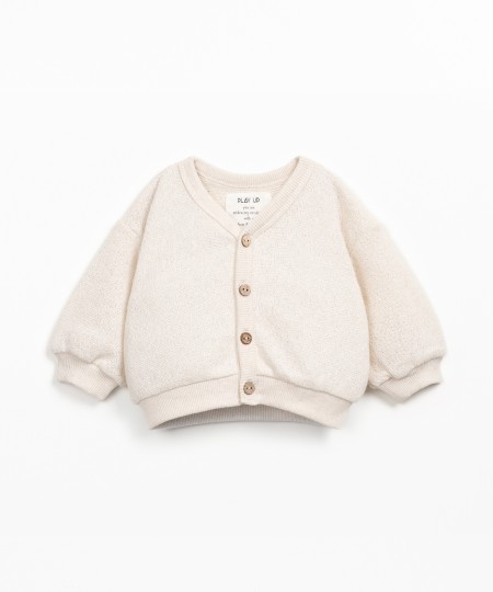 Knit cardigan with Re(Play) yarn