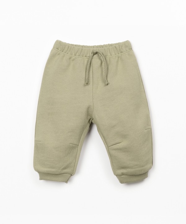 Trousers with decorative drawstring