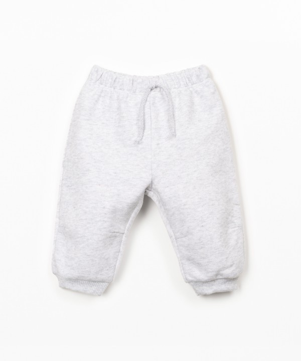 Trousers with decorative drawstring