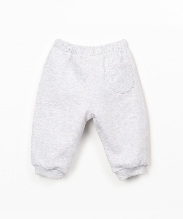 Trousers with decorative drawstring