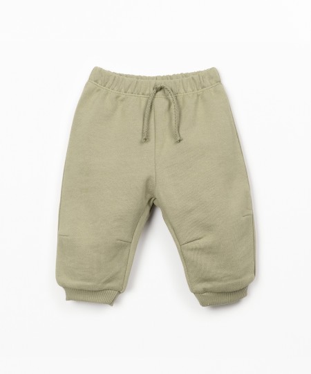 Trousers with decorative drawstring