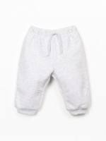 Trousers with decorative drawstring