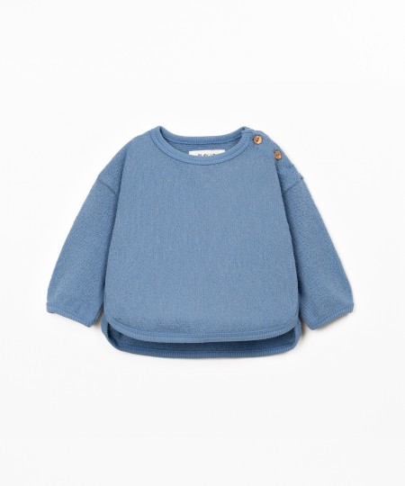 Knit sweater with recycled fibers