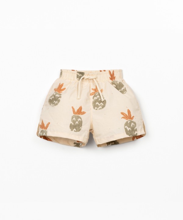Swim shorts with palm pineapple print