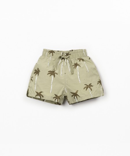 Swim shorts with palm tree print