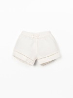 Cal��o de linho com pormenor de renda