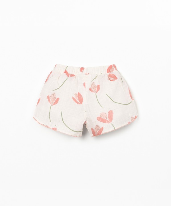 Cal��o de tecido com encaixes laterais