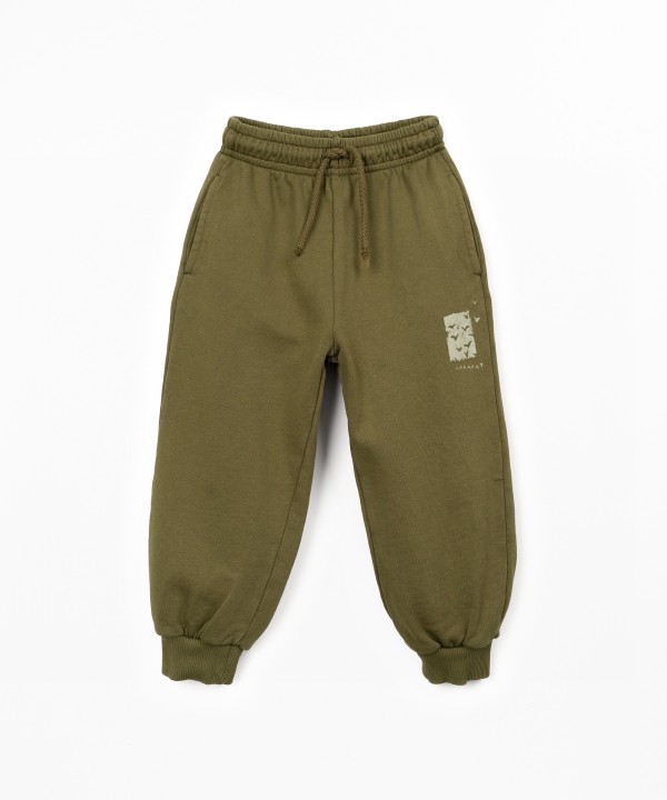 Trousers in natural fibers with design