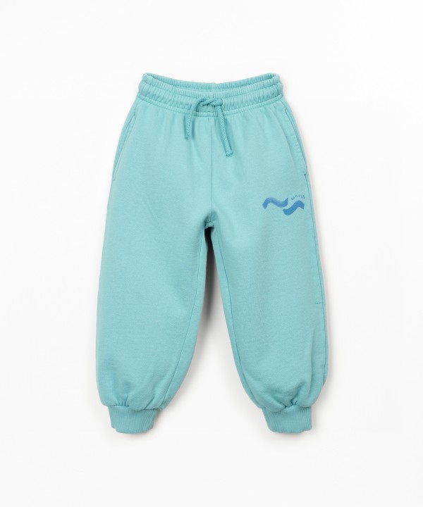 Trousers in natural fibers with print