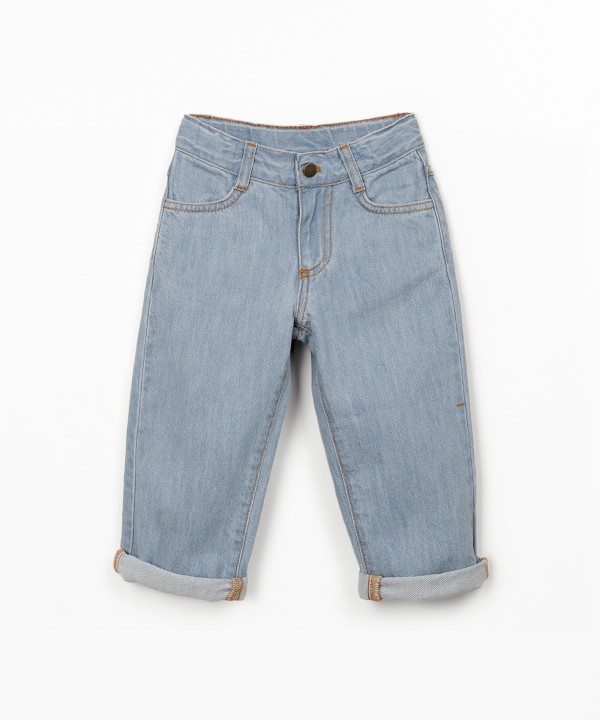 Denim trousers with adjustable belt