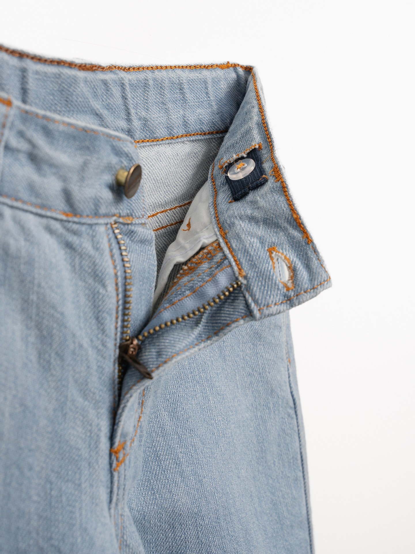 Denim trousers with adjustable belt