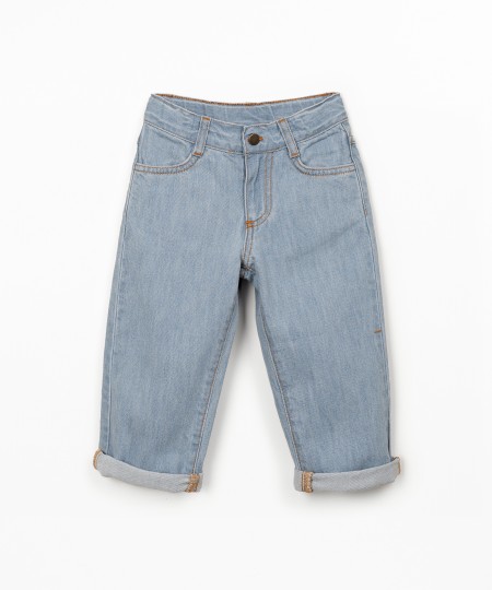 Denim trousers with adjustable belt