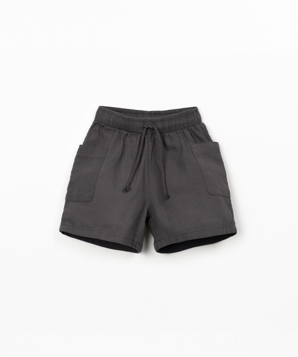 Fabric shorts with adjustable drawstring
