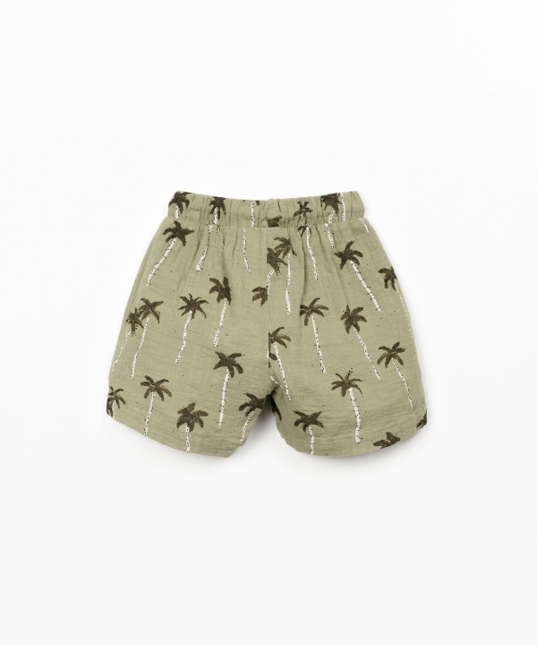 Organic cotton shorts with palm tree print