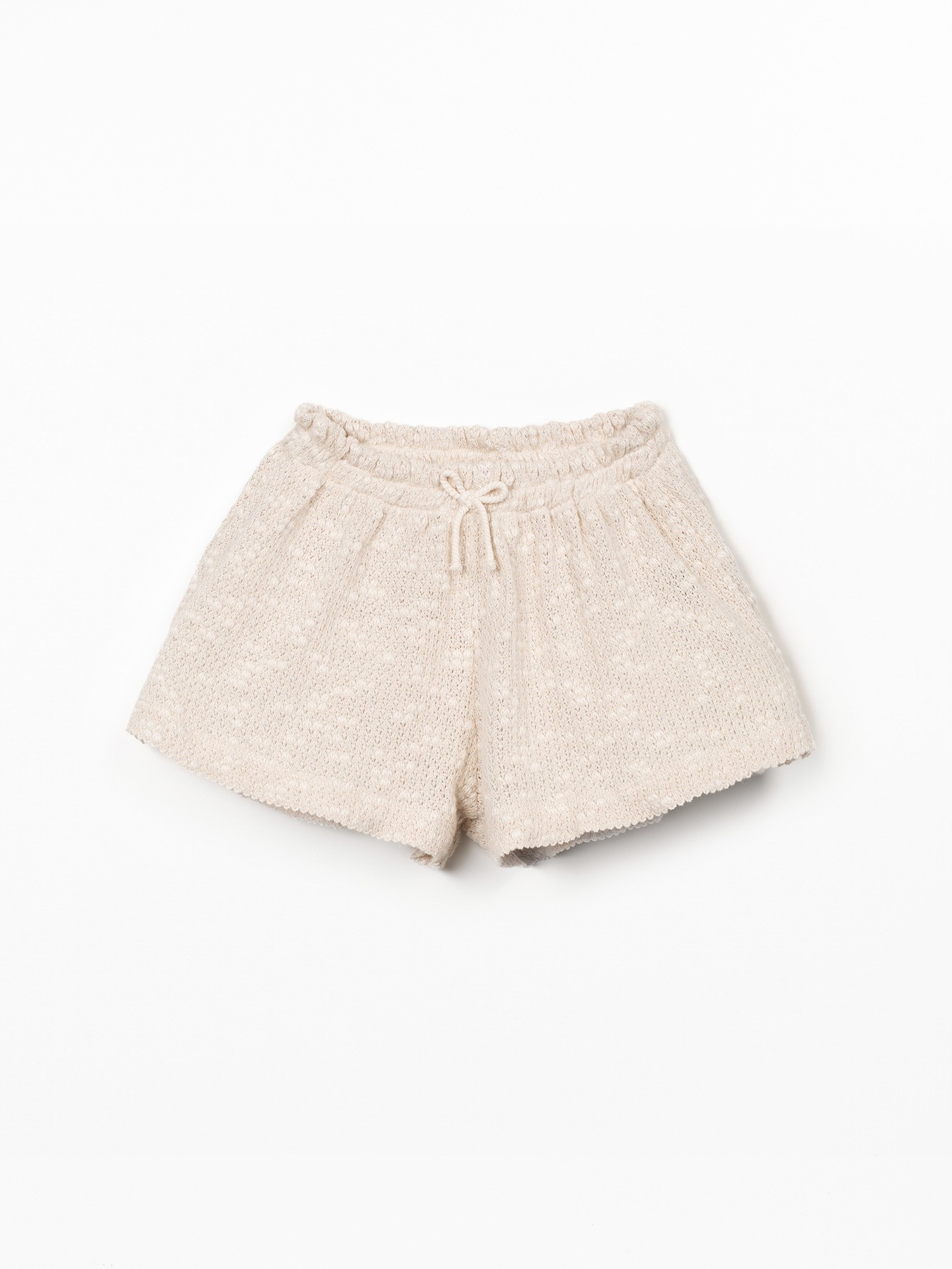 Jersey shorts with crochet effect